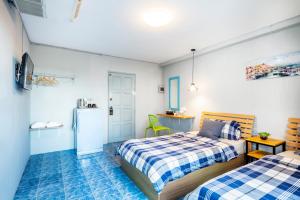 Katil atau katil-katil dalam bilik di Penyos Suite