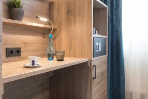 Kuchyň nebo kuchyňský kout v ubytování Hotel dasPaul