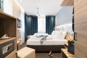 Postel nebo postele na pokoji v ubytování Hotel dasPaul