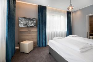 Postel nebo postele na pokoji v ubytování Hotel dasPaul
