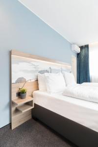 Postel nebo postele na pokoji v ubytování Hotel dasPaul