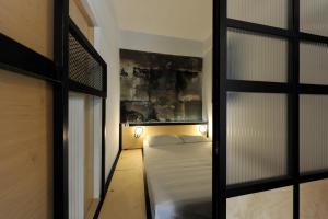 A bed or beds in a room at Semedaki, a modern appartment in the centre of history