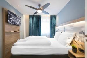 Postel nebo postele na pokoji v ubytování Hotel dasPaul