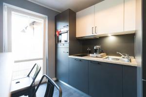 Kuchyň nebo kuchyňský kout v ubytování Hotel dasPaul