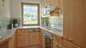 Kuchyňa alebo kuchynka v ubytovaní Komfort-Apartments Zufriedenheit