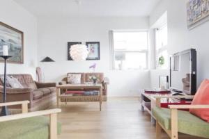 a living room with a couch and a table at City center, Tórshavn in Tórshavn