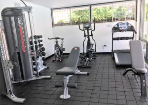 a gym with bikes and exercise equipment in a room at Vallclaire Suites in Barranquilla