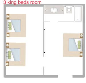 norwalk inn & suites في نورووك: رسم منزل مع غرفة سرير