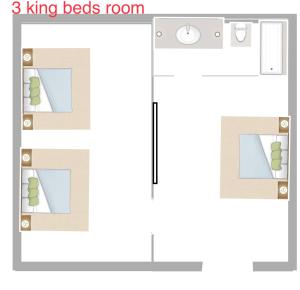 un disegno di una casa con una camera da letto di norwalk inn & suites a Norwalk