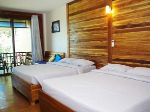 Postel nebo postele na pokoji v ubytování The Cinnamon & SaphanSufan Resort Kohmak