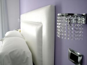 Posteľ alebo postele v izbe v ubytovaní Hotel Bruman