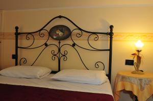 Łóżko lub łóżka w pokoju w obiekcie Locanda Sant'Anna Hotel