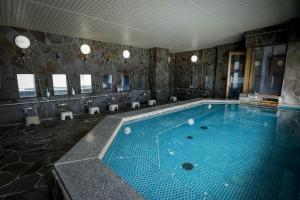 a large swimming pool in a hotel room at Xplore by Active Life in Iiyama