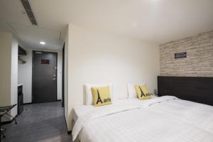 Voodi või voodid majutusasutuse Home Rest Hotel toas