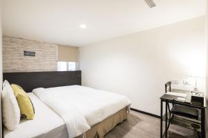 Voodi või voodid majutusasutuse Home Rest Hotel toas
