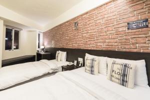 Voodi või voodid majutusasutuse Home Rest Hotel toas