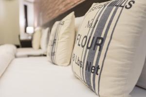 Voodi või voodid majutusasutuse Home Rest Hotel toas