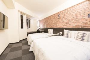 Voodi või voodid majutusasutuse Home Rest Hotel toas