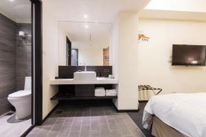 Vannituba majutusasutuses Home Rest Hotel