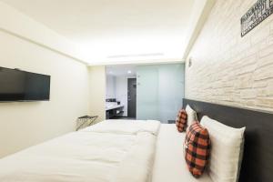 Home Rest Hotel tesisinde bir odada yatak veya yataklar