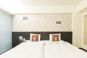Voodi või voodid majutusasutuse Home Rest Hotel toas