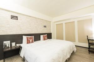Voodi või voodid majutusasutuse Home Rest Hotel toas