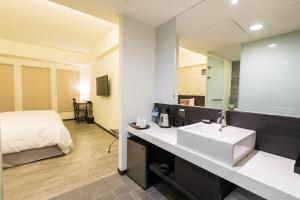 Voodi või voodid majutusasutuse Home Rest Hotel toas