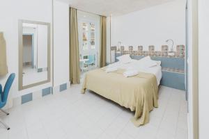 Postel nebo postele na pokoji v ubytování Hostal Gravina