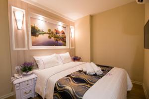 Postel nebo postele na pokoji v ubytování Lavender Inn USJ
