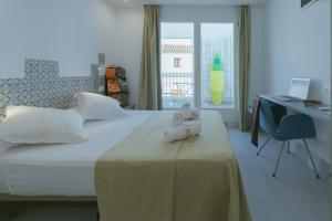 Postel nebo postele na pokoji v ubytování Hostal Gravina