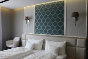 Postel nebo postele na pokoji v ubytování Hotel Merops Mészáros