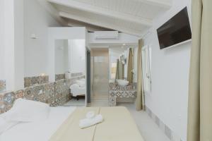 Postel nebo postele na pokoji v ubytování Hostal Gravina