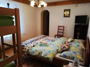 a bedroom with a bed and a bunk bed at Apartment Resman in Tršće