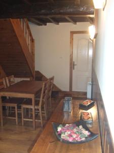 a dining room with a table and a table and chairs at Casa Fuente el vache in Campomanes