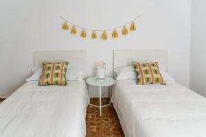Postel nebo postele na pokoji v ubytování Hostal Beni + 37 fotografií