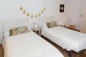 Postel nebo postele na pokoji v ubytování Hostal Beni