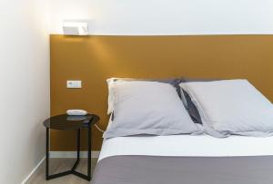 Postel nebo postele na pokoji v ubytování Hotel Concheiros