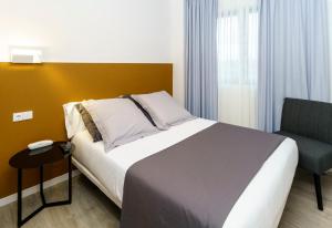 Cama o camas de una habitación en Hotel Concheiros