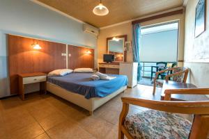 Postel nebo postele na pokoji v ubytování Sun Hotel