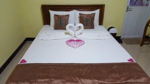 Säng eller sängar i ett rum på Avian Garden Udawalawe