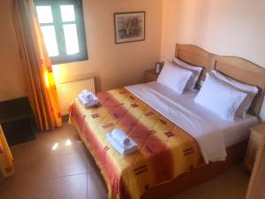 Posteľ alebo postele v izbe v ubytovaní Alonissos Muses Villas