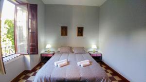 Postel nebo postele na pokoji v ubytování Apartamento Plaza de Doña Elvira 8