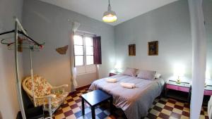 Postel nebo postele na pokoji v ubytování Apartamento Plaza de Doña Elvira 8