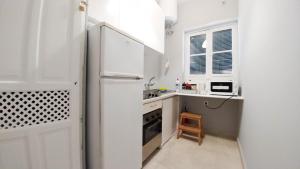 Kuchyň nebo kuchyňský kout v ubytování Apartamento Plaza de Doña Elvira 8