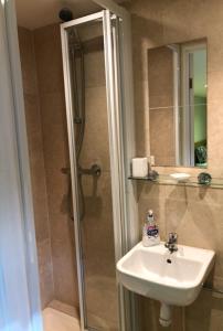 a bathroom with a shower and a sink and a shower at Agars Place, Datchet in Datchet