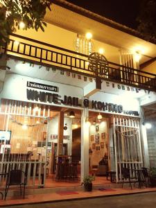 a building with a sign that reads white doth lookup at White Jail at Koh Tao Hostel in Koh Tao