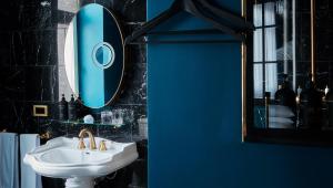 a bathroom with a sink and a mirror at Provocateur Berlin in Berlin