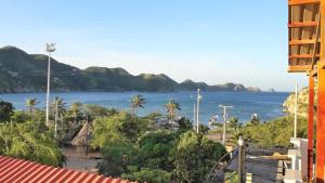 a large building with a view of the ocean at Hotel San Marcos Taganga in Taganga