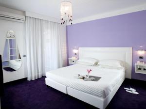 Posteľ alebo postele v izbe v ubytovaní Hotel Bruman