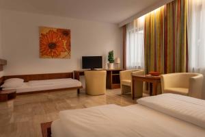 Łóżko lub łóżka w pokoju w obiekcie Hotel Anker